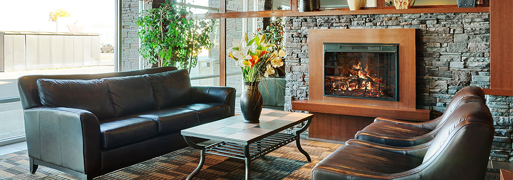 Stonebridge in Fort St. John front lobby seating area has an electric fire place