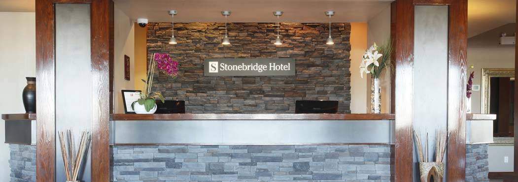 Fort St. John front desk of Stonebridge Hotel with two check in & out terminals
