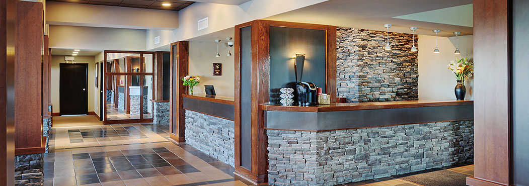 Stonebridge Hotel in Fort St. John reception desk with  stone color pillars